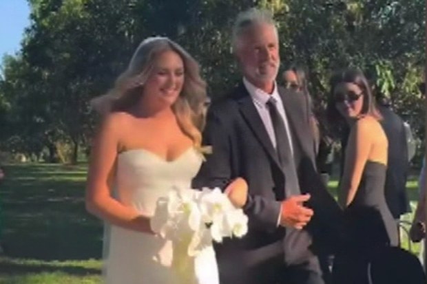 Savannah Spence and her dad on her wedding day