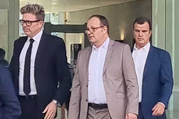 Mark Sheridan Waden (centre) leaves court with his legal team, James Godbolt (right) and Nick Dore (left).