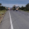 Logan woman killed in rollover, debris covers Queensland highway