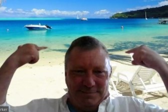 Barrister Luke Barker and his Tahitian beach background.