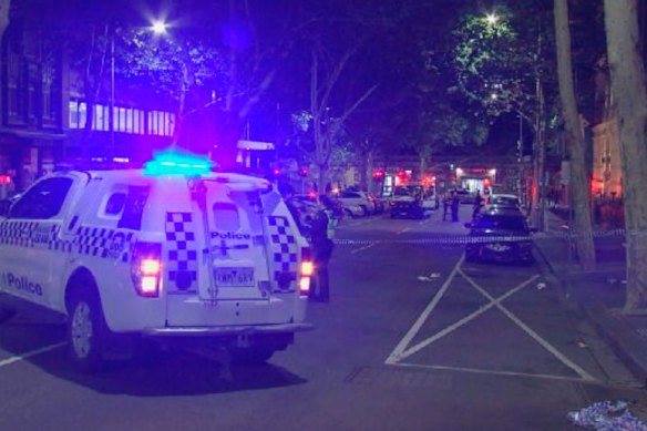 Police officers in Queen Street, Melbourne, after the attack on Monday morning.
