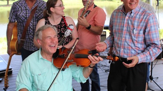 Texas Governor Greg Abbott plays the fiddle as the state’s coronavirus cases surge.
