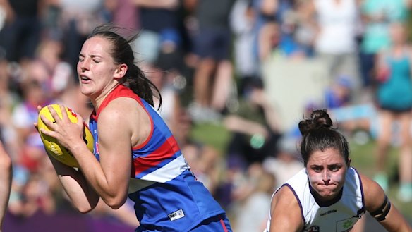 Forward thinking: Isabel Huntington marks in front of her opponent.