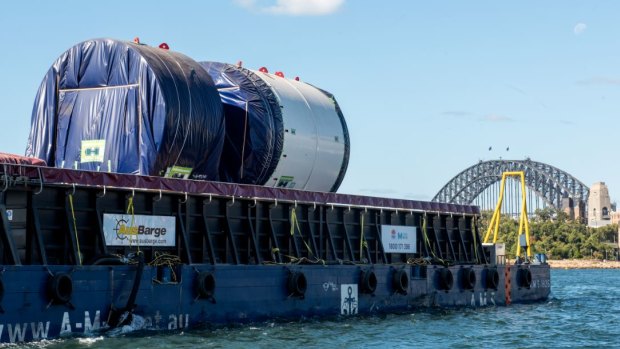 Parts of Kathleen are barged to Barangaroo where she will be assembled before she starts digging two kilometre-long tunnels under Sydney Harbour.