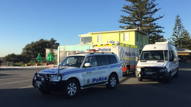 Police at Newcastle's Stockton Beach after the body of an elderly man was found.