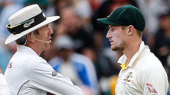Caught: Umpires Richard Illingworth (left) and Nigel Llong confront Cameron Bancroft in Cape Town, scene of the sandpapergate crime.