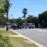 Stolen 4WD flips onto roof after collision at Ipswich intersection, two injured