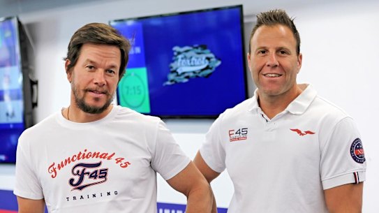F45 owner Rob Deutsch, right, with actor Mark Wahlberg, who bought a minority stake in the company in 2019.
