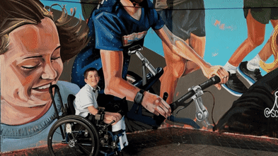 Anger after mural of young runner with cerebral palsy painted over