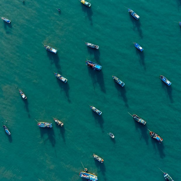 The turquoise waters and fishing boats of Ke Ga village.
