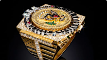 The ring is encrusted in hundreds of diamonds.