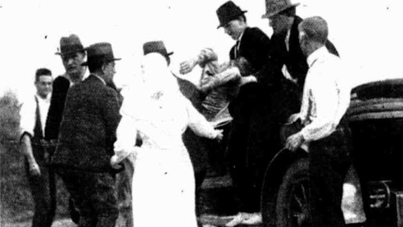 Maple is carried by police to the hospital at Warragul, where he was taken after he was shot. He died half an hour later.