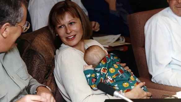 Anna Booth was responsible for winning the outworkers case of 1987. Here she is seen with her son Angus at a meeting of the ACTU executive. She later became deputy president of the Fair Work Commission.