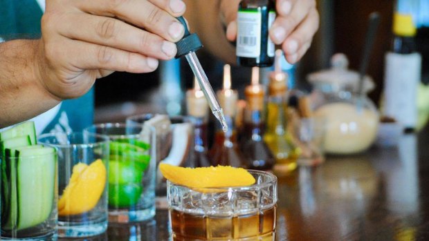 A bartender prepares a CBD infused Stoney Negroni at Adriaen Block, a bar and restaurant in Queens