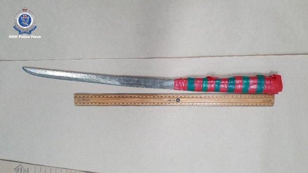 A samurai sword was among the items police seized in the search of the two homes. 