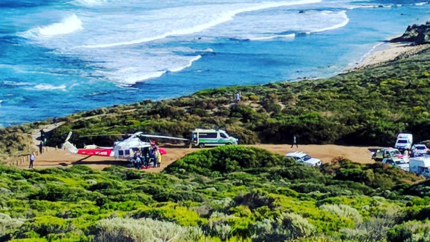 Ambulances arrive at the South West surf break last week after the first shark attack of the day.