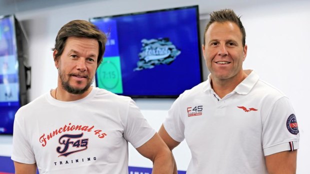 F45 owner Rob Deutsch, right, with actor Mark Wahlberg, who bought a minority stake in the company in 2019.