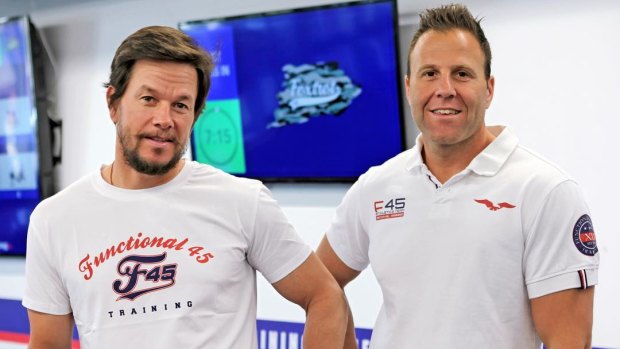 F45 owner Rob Deutsch, right, with actor Mark Wahlberg, who signed up to the company earlier this year after a sale process run by Deutsche Bank.