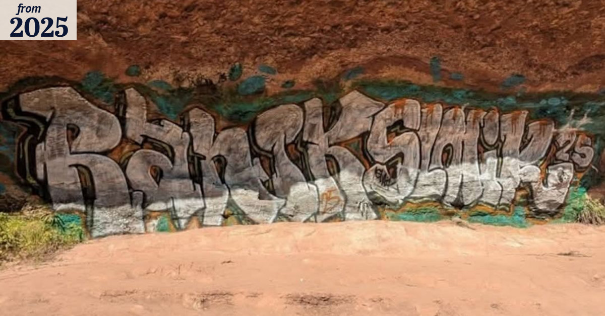 Two men arrested, one charged over graffiti at sacred Indigenous site