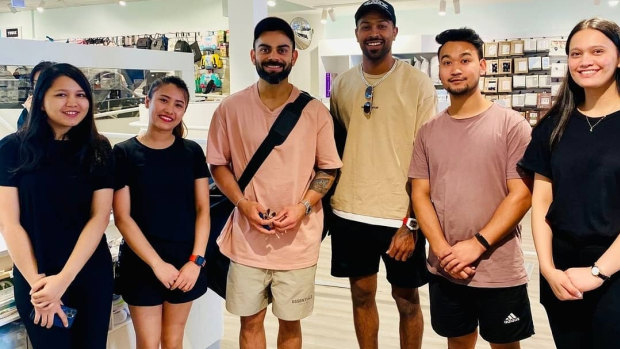 Virat Kohli and Hardik Pandya pose for photos at a baby shop last month.