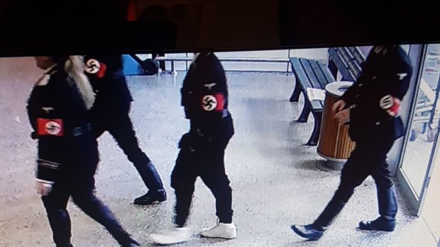 A photo from inside the Coles supermarket at Woodend shows four people entering the store in Nazi regalia.
