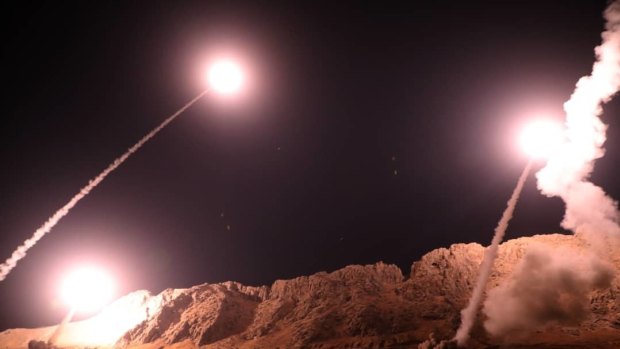 In this photo released on Monday by the Iranian Revolutionary Guard, missiles are fired from the city of Kermanshah in western Iran targeting the Islamic State group in Syria. 