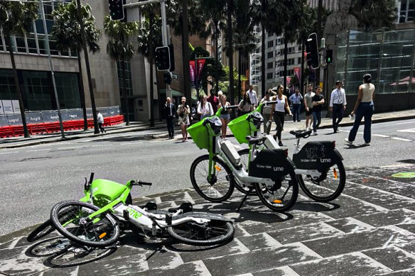 City workers and visitors are forced to step over or around shared bikes discarded on footpaths in the Sydney CBD.