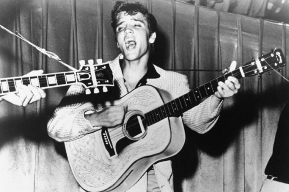 This 1956 photo of Elvis Presley performing was used for his first RCA Victor album cover.