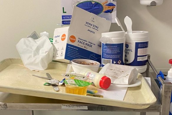 Photos taken in the Alfred's COVID-19 ward show trolleys and bins overflowing with contaminated waste.