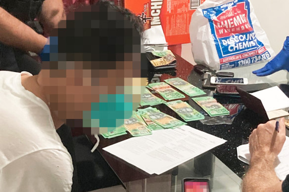 An illegal worker has been arrested at Operation Underpitch after a scheme was uncovered to withdraw $137 million in cash to pay construction workers and avoid taxes.