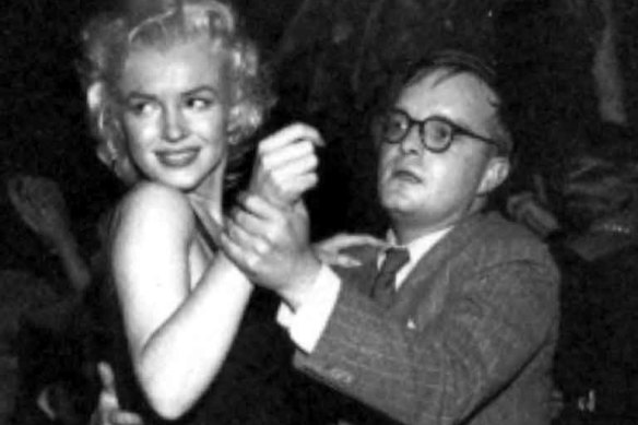Truman Capote with Marilyn Monroe.