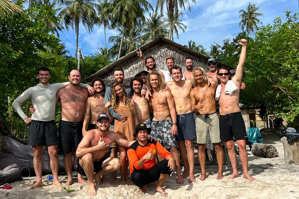 The Australians, the boat captain and those who helped rescue them on Pinang Island on Wednesday.