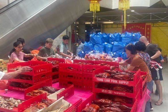 Chinese Singaporeans buy roast duck, pork and crab in preparation for the Hungry Ghost Festival. 