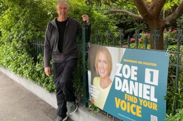 Zoe Daniel’s campaign director Keith Badger with the sign on his front fence.