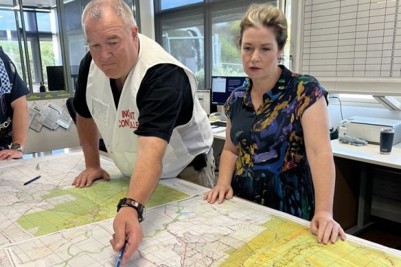 Fire Rescue Victoria incident controller Mark Gunning (left) and Lowan MP Emma Kealy discuss the Pomonal fire in February.
