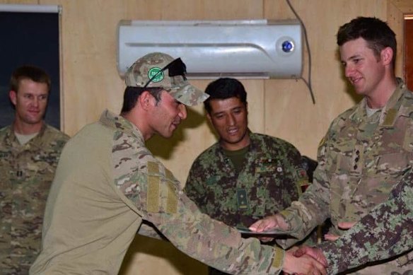 Shahwar receives a certificate of commendation in 2013 for his services as a translator.