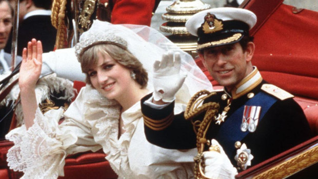 The Princess and Prince of Wales wave from their carriage on their wedding day in 1989.