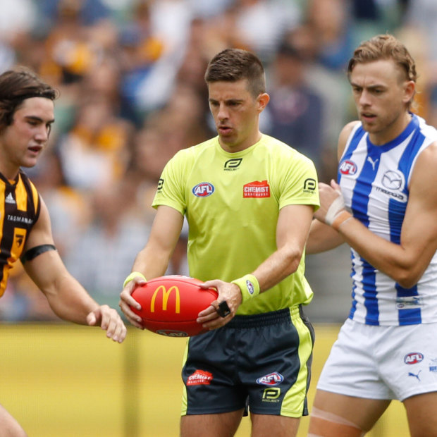 Umpire Michael Pell officiates during the round one AFL match between Hawthorn and North Melbourne at the MCG on March 20.