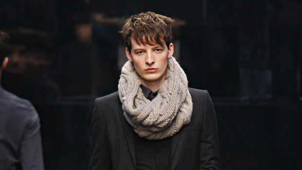 A model wearing a snood, which is not considered a face mask in Queensland.