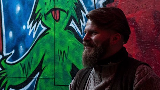 Alex Malenki, right, and his wife, Ingrid Weiss, at a Christmas market hosted by Generation Identity, a far-right youth movement, in Halle, Germany.