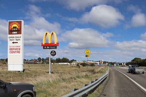 A concept image of the Guzman y Gomez billboard on the side of the Hume Highway.