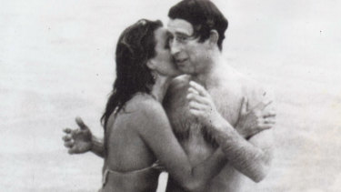 Prince Charles is kissed by Perth model Jane Priest while at Cottesloe Beach.