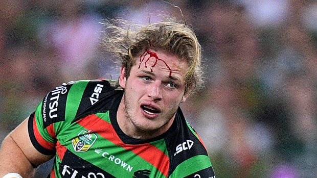 Collision: George Burgess bleeds heavily after a head clash with his brother Tom.