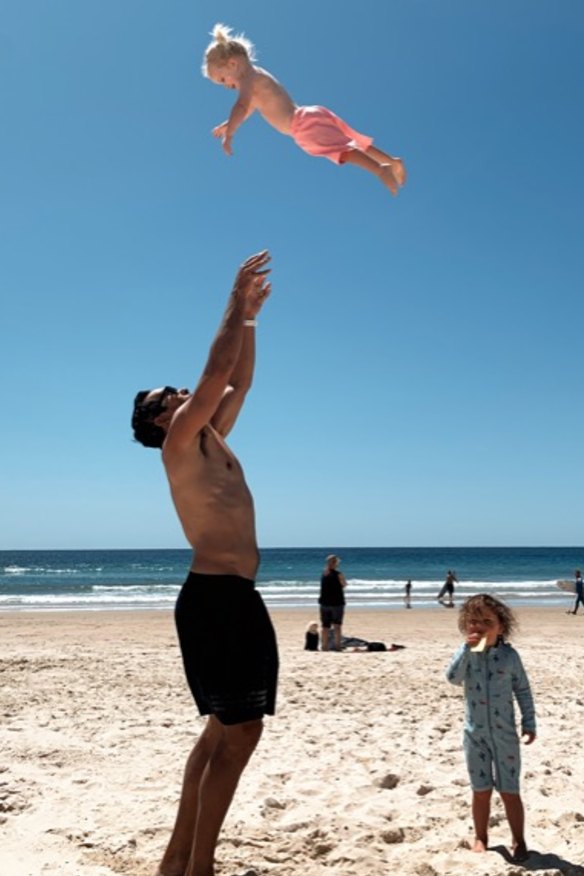 Betts with his family at the beach, one of the photos included in his new book.