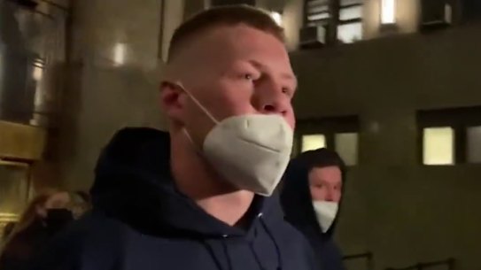 Collingwood star Jordan De Goey leaves a New York court after he was earlier arrested earlier.