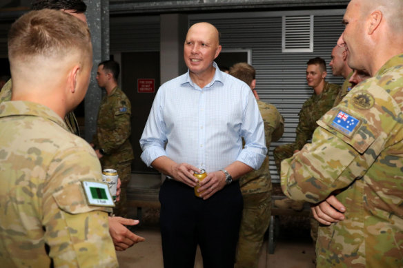 Peter Dutton met soldiers in Townsville last month.