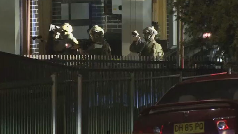 Sydney man charged over alleged public shooting plot after tactical police storm house