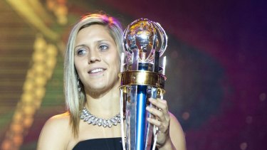 Cafe employee Katrina Gorry with her trophy after winning the Asian Football Confederation Player of the Year and AFC Woman Player of the Year in Manila in 2014.

