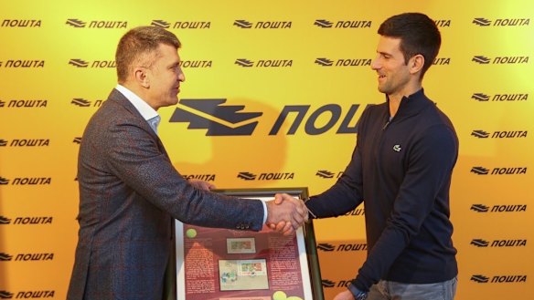 Djokovic attends a ceremony to honour him with his own postage stamp on December 16.