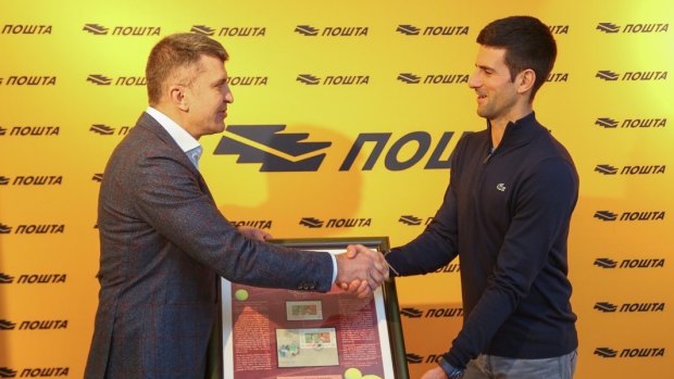 Djokovic attends a ceremony to honour him with his own postage stamp on December 16.
